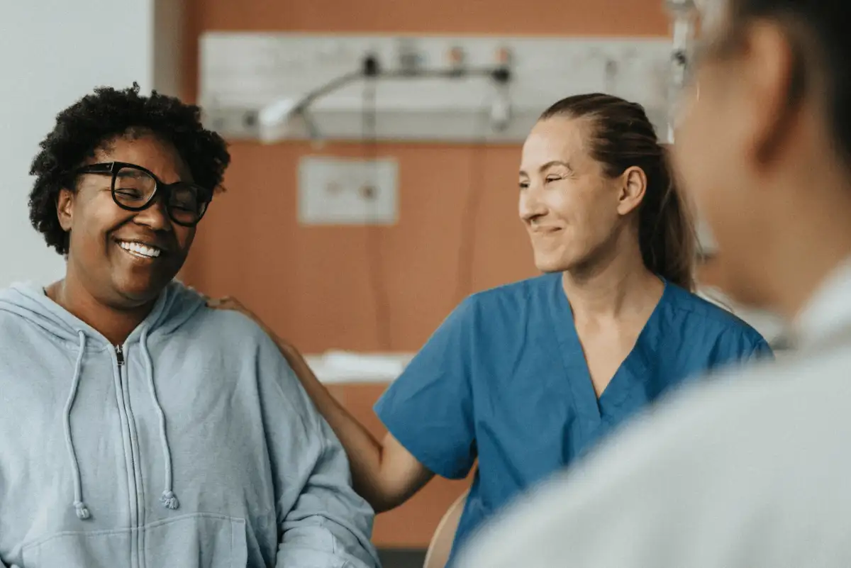 A doctor and patient in a healthcare setting. Docusign can help healthcare professionals improve the patient journey.